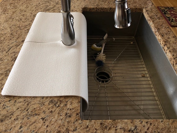 How Faucet Mats Prevent Sink Water Damage